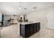 Spacious kitchen with island, open to the living room, with modern finishes and natural light at 542 Patton Loop, Bartow, FL 33830