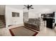 Living room features tile flooring, sofa, and open access to the kitchen at 542 Patton Loop, Bartow, FL 33830