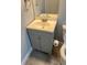 Bright bathroom featuring a single sink vanity with neutral colors and a large mirror at 5508 Andora St, Orlando, FL 32807