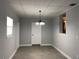 The dining room has neutral walls, tile floors and a white door and trim at 5508 Andora St, Orlando, FL 32807