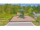 Community playground equipment featuring slides, a shaded roof, and a staircase at 570 Pink Ibis Bnd, St Cloud, FL 34772
