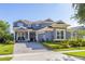 Charming two-story home with landscaped yard and paver driveway at 7837 Bostonian Dr, Winter Garden, FL 34787