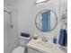 Clean bathroom featuring a white sink and cabinet, decorative mirror, shower and tub at 9301 Echo Run, Orlando, FL 32817
