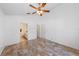 Bright bedroom featuring tile floors, a ceiling fan, and neutral colors, providing a serene and comfortable retreat for relaxation at 9301 Echo Run, Orlando, FL 32817