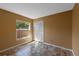 Cozy bedroom featuring tile floors, a window with backyard views, and a spacious closet, perfect for a comfortable and organized space at 9301 Echo Run, Orlando, FL 32817