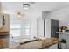 Well-equipped kitchen featuring granite countertops, modern stainless steel appliances, and plenty of natural light from the bay windows at 9301 Echo Run, Orlando, FL 32817