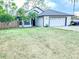 Charming single-Gathering home featuring a two-car garage, inviting front yard, and well-maintained landscaping at 1002 Courtland St, Orlando, FL 32804