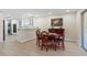 Open dining area with wood table set adjacent to the kitchen and bright with natural light from sliding glass door at 110 Tedworth Ct, Longwood, FL 32779