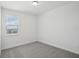 Neutral bedroom boasts a bright window with a view at 16484 Silver Brook Way, Winter Garden, FL 34787