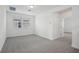 Spacious bedroom with neutral carpet, natural light, and an open doorway to another room at 16484 Silver Brook Way, Winter Garden, FL 34787