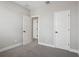 Bedroom featuring neutral walls, plush carpet, and white doors at 16484 Silver Brook Way, Winter Garden, FL 34787