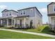 Inviting two-story home with a cozy front porch and well-maintained lawn at 16484 Silver Brook Way, Winter Garden, FL 34787