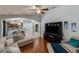 Bright living room with hardwood floors, comfortable seating, and an open layout for easy entertaining at 16843 Cedar Run Dr, Orlando, FL 32828