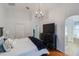 Serene main bedroom with hardwood floors, ample closet space, and an en-suite bathroom with a glass shower at 16843 Cedar Run Dr, Orlando, FL 32828
