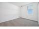 Neutral bedroom with carpeted floors and a window for ample natural light at 4709 Jasmine Cir, Leesburg, FL 34748