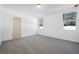 Bedroom with carpeted floor and a window for natural light at 4709 Jasmine Cir, Leesburg, FL 34748