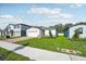 A beautiful single-story home with a brick driveway and lush green lawn in a suburban neighborhood at 4709 Jasmine Cir, Leesburg, FL 34748