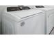Modern white Whirlpool washer and dryer set in a well-lit laundry area at 4709 Jasmine Cir, Leesburg, FL 34748