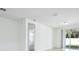 Open living room with tile floors and sliding door access to backyard at 4709 Jasmine Cir, Leesburg, FL 34748