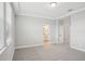Bright bedroom with gray carpet, recessed lighting, and ensuite bathroom access at 5133 Passion Flower Way, Winter Garden, FL 34787