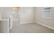 Neutral bedroom featuring plush carpeting and natural light from the window at 5133 Passion Flower Way, Winter Garden, FL 34787