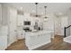 Modern kitchen featuring an island, stainless steel appliances, and stylish pendant lighting at 5133 Passion Flower Way, Winter Garden, FL 34787