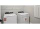 This laundry room features new Whirlpool washer and dryer appliances at 5133 Passion Flower Way, Winter Garden, FL 34787