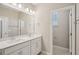 A well-lit bathroom has a double vanity and a separate toilet room at 5139 Passion Flower Way, Winter Garden, FL 34787