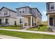 Attractive exterior view of a two-story home with a well-maintained lawn and sidewalk at 5139 Passion Flower Way, Winter Garden, FL 34787