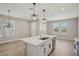 Open concept kitchen/living space with modern fixtures and stainless steel appliances, promoting an airy atmosphere at 5139 Passion Flower Way, Winter Garden, FL 34787