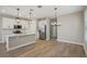 Bright kitchen with stainless appliances, a center island, and a dining area at 5139 Passion Flower Way, Winter Garden, FL 34787