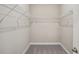 Inside the walk-in closet, white shelving provides ample storage space at 5139 Passion Flower Way, Winter Garden, FL 34787
