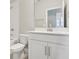 A clean bathroom has a white vanity, toilet and bathtub with shower at 5217 Passion Flower Way, Winter Garden, FL 34787