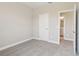 A carpeted bedroom offers base trim and an attached bathroom with a double sink at 5217 Passion Flower Way, Winter Garden, FL 34787