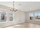 Elegant dining area with ample natural light and stylish chandelier at 5217 Passion Flower Way, Winter Garden, FL 34787