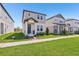 Lovely home featuring a neat lawn, covered porch, and a contemporary design at 5217 Passion Flower Way, Winter Garden, FL 34787