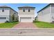 A multi-level two-story home with brick paver driveway at 5217 Passion Flower Way, Winter Garden, FL 34787