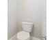 An enclosed water closet features a white toilet and chrome towel bar at 5217 Passion Flower Way, Winter Garden, FL 34787