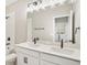 Bathroom featuring double sinks, black fixtures, tile floors, tub and shower at 5235 Passion Flower Way, Winter Garden, FL 34787