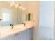Bathroom featuring double sinks, quartz countertops, and view of a bedroom at 6550 Cartmel Ln, Windermere, FL 34786