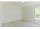 Bright bedroom with neutral walls, trim, and light-colored flooring at 6550 Cartmel Ln, Windermere, FL 34786