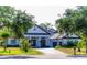 Stunning home with a classic design, lush landscaping and a brick driveway at 6550 Cartmel Ln, Windermere, FL 34786