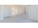 Open foyer with light wood floors, white walls, columns and lots of natural light at 6550 Cartmel Ln, Windermere, FL 34786