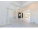 Bright foyer area with light wood floors, columns, and view into the living room at 6550 Cartmel Ln, Windermere, FL 34786