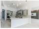 Modern kitchen with gray cabinets, stainless appliances, and quartz countertops at 6550 Cartmel Ln, Windermere, FL 34786