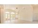 Bright and spacious living room with modern lighting and multiple french doors at 6550 Cartmel Ln, Windermere, FL 34786