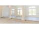 Bright and spacious living room with columns and decorative windows at 6550 Cartmel Ln, Windermere, FL 34786