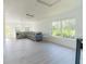 Living room with hardwood floors, plenty of natural light, and a striped sofa at 6550 Cartmel Ln, Windermere, FL 34786