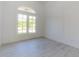 Bright living space with light floors, trim, and walls, with large window at 6550 Cartmel Ln, Windermere, FL 34786