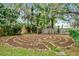 Tranquil labyrinth in the backyard surrounded by lush plants and trees that provide a calming oasis at 889 Kensington Gardens Ct, Oviedo, FL 32765